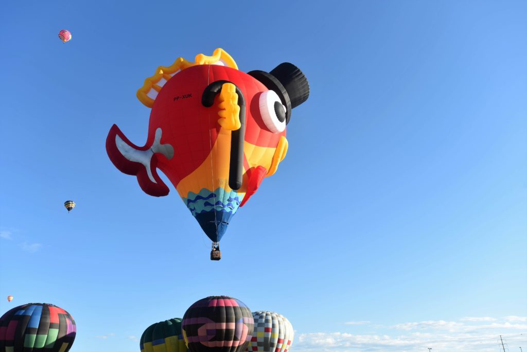 One of the best Things to do in Red River, NM is rent a hot air balloon like the one featured in this photo.