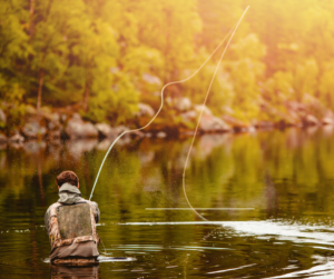 A man fly fishing. This and Taos Hiking Trails, are some of the best outdoors things you can do.