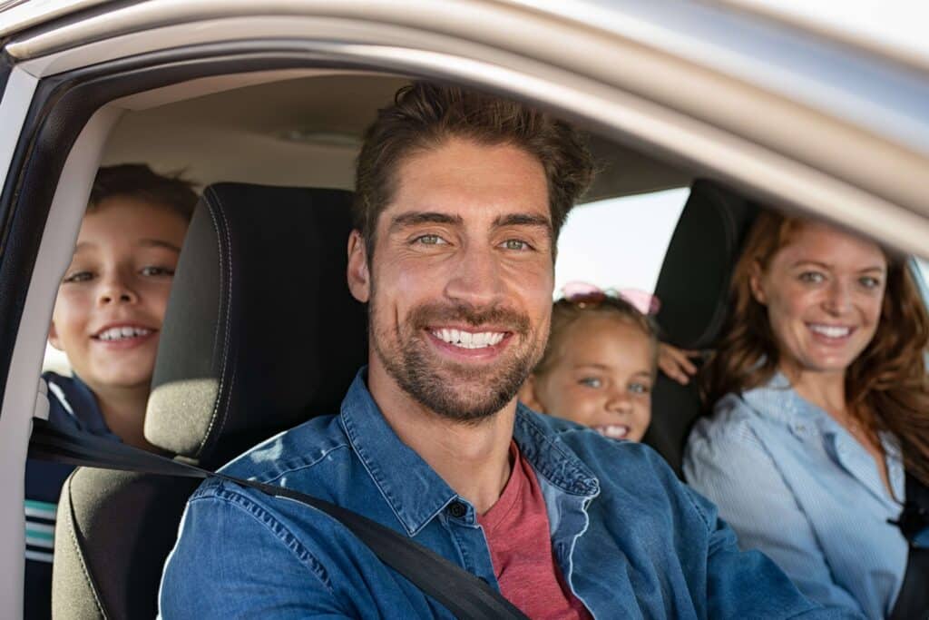 A family of four driving to their New Mexico Vacation Rentals.