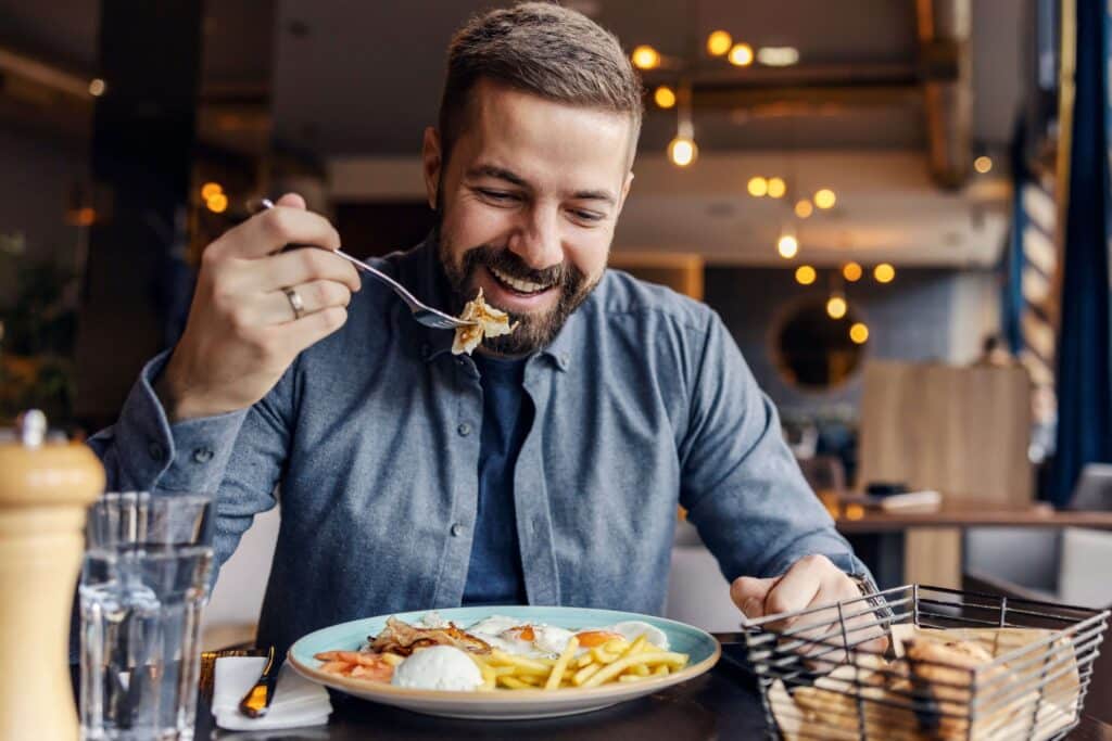 A man enjoying Red River Restaurants.